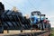 Farm tractors loaded on a freight train. Import/export of the agriculture and farming equipment.