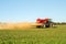 Farm Vehicle spreading lime onto a field