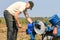 A farmer adjusting plough at ploughing match