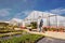 Farmer in agriculture cultivating vegetables - greenhouses in th