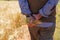 Farmer or agriculturist man holding some wheat ears