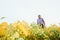 A farmer agronomist inspects soybeans growing in a field. Agriculture