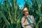 Farmer agronomist with tablet computer in corn crop field