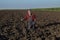 Farmer analyze arable land