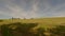 A farmer in Bavaria cuts the grass in a field in summer. Farmer with agricultural equipment mows the meadow and makes