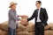 Farmer and a businessman shaking hands