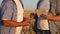 Farmer and businessman with tablet working as a team in field. agronomist and farmer are holding a grain of wheat in