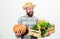 Farmer carry harvest. Farmer lifestyle professional occupation. Buy local foods. Farmer rustic bearded man hold wooden