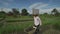 Farmer carry wheelbarrow with soil