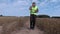 Farmer on cereal field with walkie talkie