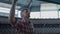 Farmer checking milking parlor equipment closeup. Focused worker examining cow