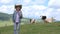 Farmer Child Pasturing Cows, Cowherd Girl with Cattle on Meadow in Mountains 4K