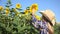 Farmer Child in Sunflower Field, Girl Studying Playing in Agrarian Harvest