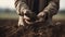 Farmer close-up holds the earth in his hands, planting plants.