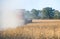 Farmer combining soybeans