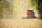 Farmer combining soybeans