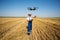 Farmer Control a drone on the wheat field.