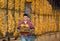 Farmer with corn cobs