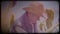 A farmer in a corn field. An elderly man in a straw hat and waistcoat walks through a corn field and checks the harvest