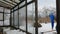 The farmer covers the greenhouse beds with snow