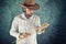 Farmer with cowboy straw hat holding wheat ears