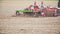 Farmer cultivating field. Close up view