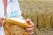 Farmer is cut bread with knife.