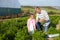 Farmer With Daughter Harvesting Organic Carrot Crop On Farm