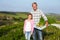 Farmer With Daughter Harvesting Organic Carrot Crop On Farm