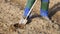 farmer digging soil by shovel