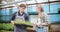 Farmer Discussing With Agronomist In Greenhouse.