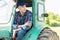 Farmer driving tractor in countryside