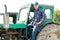 Farmer driving tractor in countryside