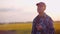 Farmer Examining Crops At Agriculture Field Harvesting Crops