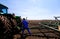 Farmer fixing a tractor