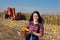 Farmer girl with corn in basket