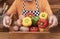 Farmer hands hold raw vegetables over a wooden basket, potatoes and peppers, nutrition and healthy lifestyle - active retired