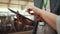 Farmer hands holding tablet computer closeup. Specialists discussing data in pad