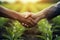 farmer handshake on agricultural field