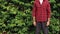 Farmer with hat smiling in coffee plantation field landscape