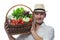 Farmer in a hat and white shirt carries on his shoulder a basket