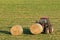 Farmer and hay bales