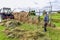 Farmer and hayrack, traditional haymaking nordic style in Finnish Lapland