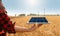 Farmer is holding a digital tablet with solar panels and wind turbines