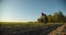 Farmer holding ground in hands closeup while sunset. Male hands touching soil on the field during sunset. Farmer is checking soil