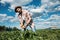 Farmer holding potatoes in field