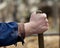 Farmer holding stick of shovel