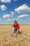 Farmer inspect wheat field