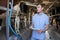 Farmer Inspecting Cattle During Milking