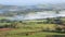 Farmer inspecting cattle in misty valley in the Brecon Beacons National Park